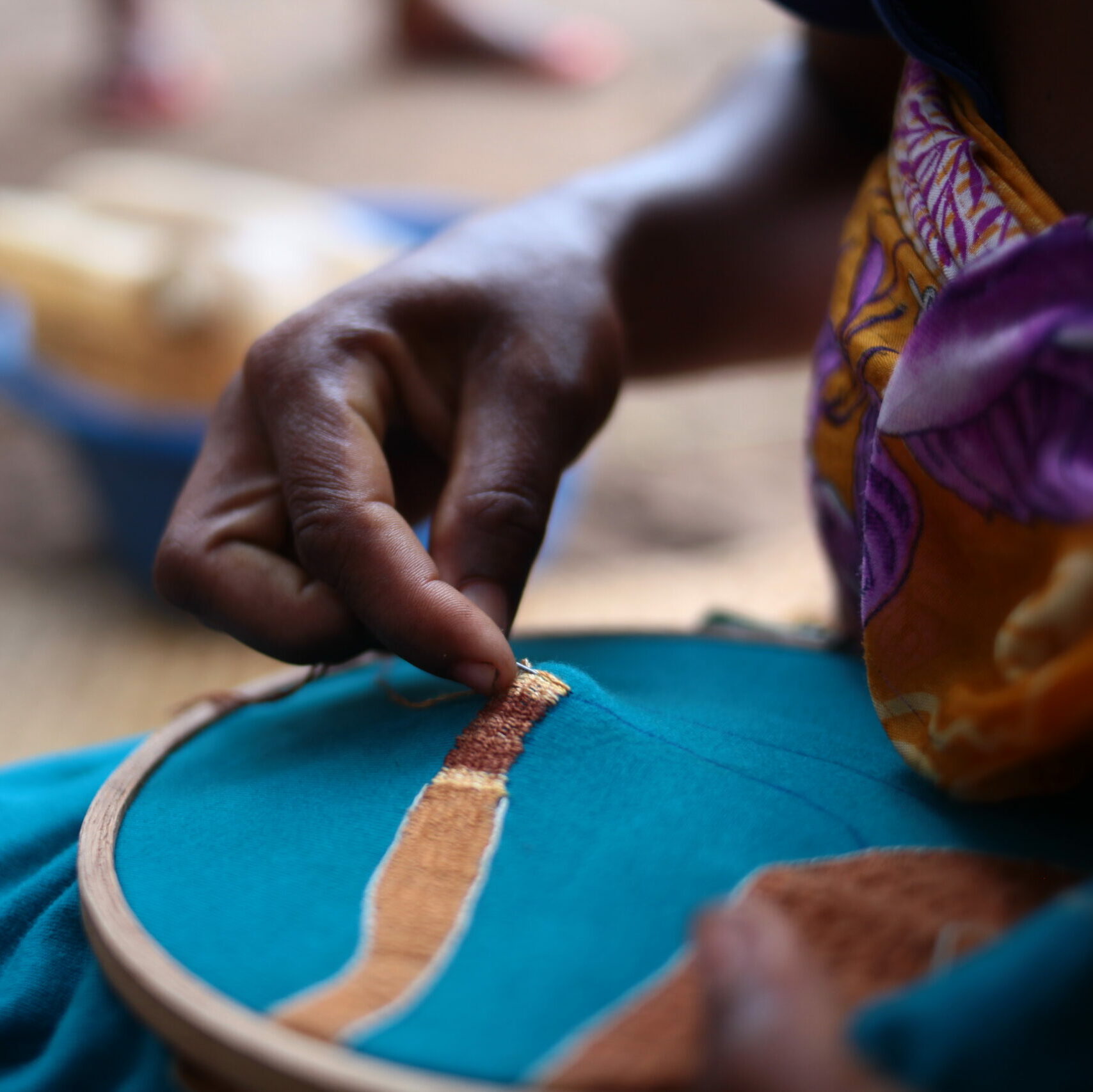 Local woman in Madagascar doing embroidery work