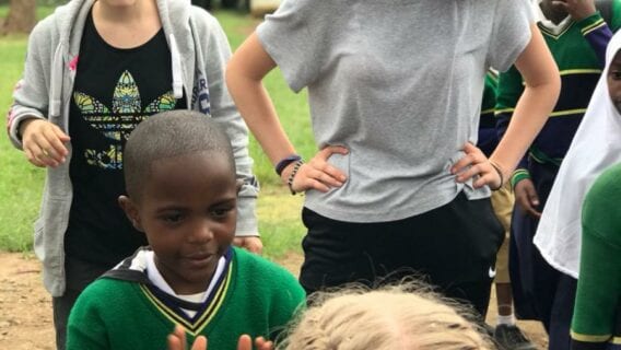 Playing with a group of children from a Tanzanian primary school